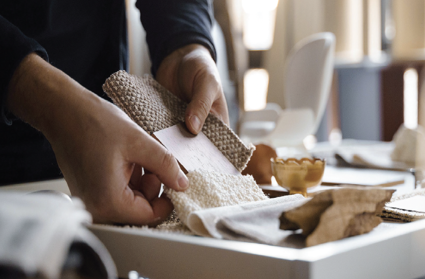 hands working with fabrics and materials