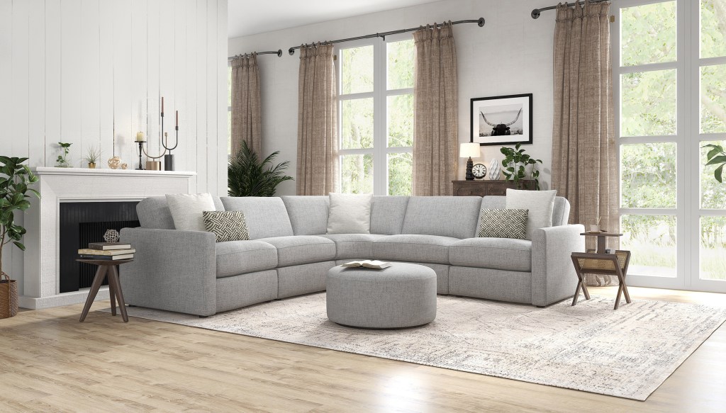 Kuka Home Furnishing's Transitional style with light grey upholstered sofa and matching ottoman