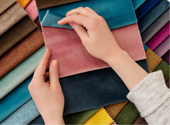 person sorting through fabric swatches 